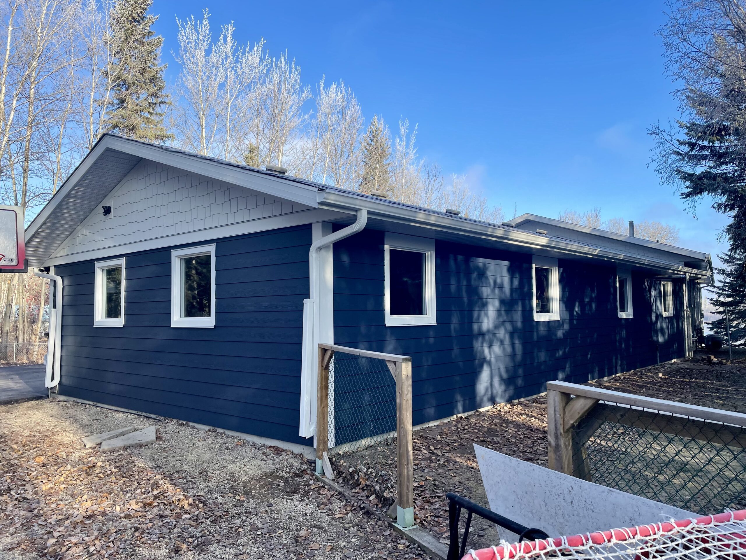 Marine Blue Hardie Plank and White James Hardie Shake Siding in Parkland County